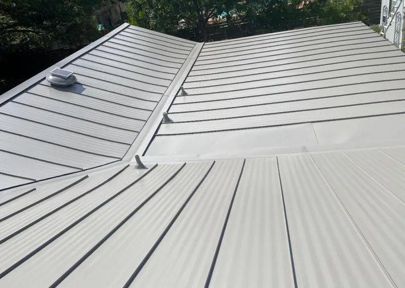 Solar attic fan installed on a metal roof for Roof Ventilation in Shasta Lake